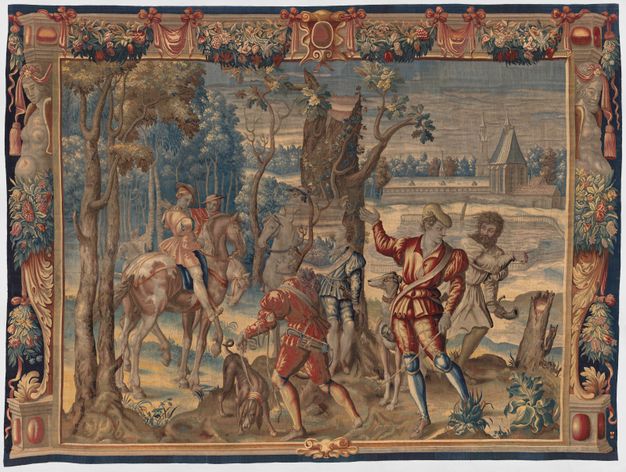 Tapestry. Two men on horseback, four standing on the ground around a broken tree trunk, and two dogs are in a landscape. The scene is framed by woven ornamental strapwork, floral swags, and corbels in the shape of people.